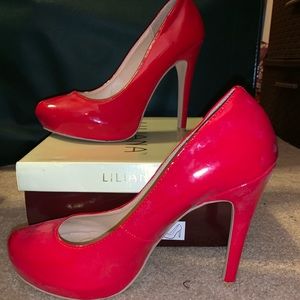 Red leather pumps